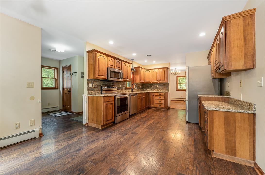 465 Raubsville Road Easton, PA 18042 - Photo 18 of 60 A warm, inviting kitchen with rich wood flooring and abundant cabinetry.