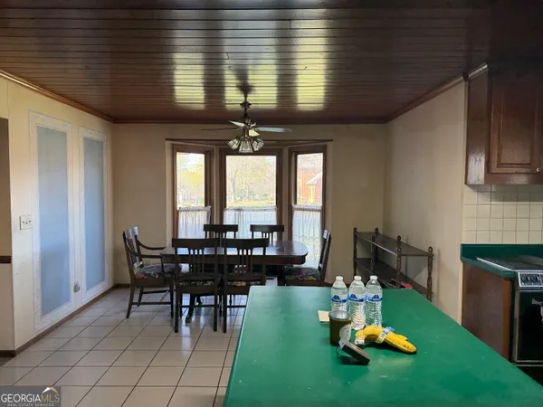 a view of a dining room with furniture window and outside view