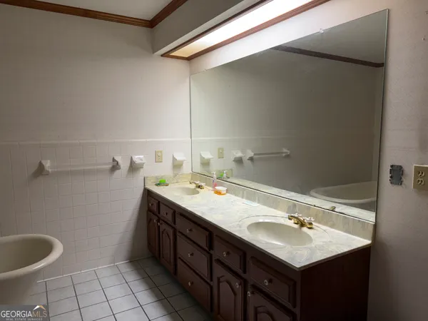a bathroom with a sink toilet and vanity