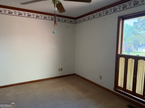 a view of a room with racks on the wall