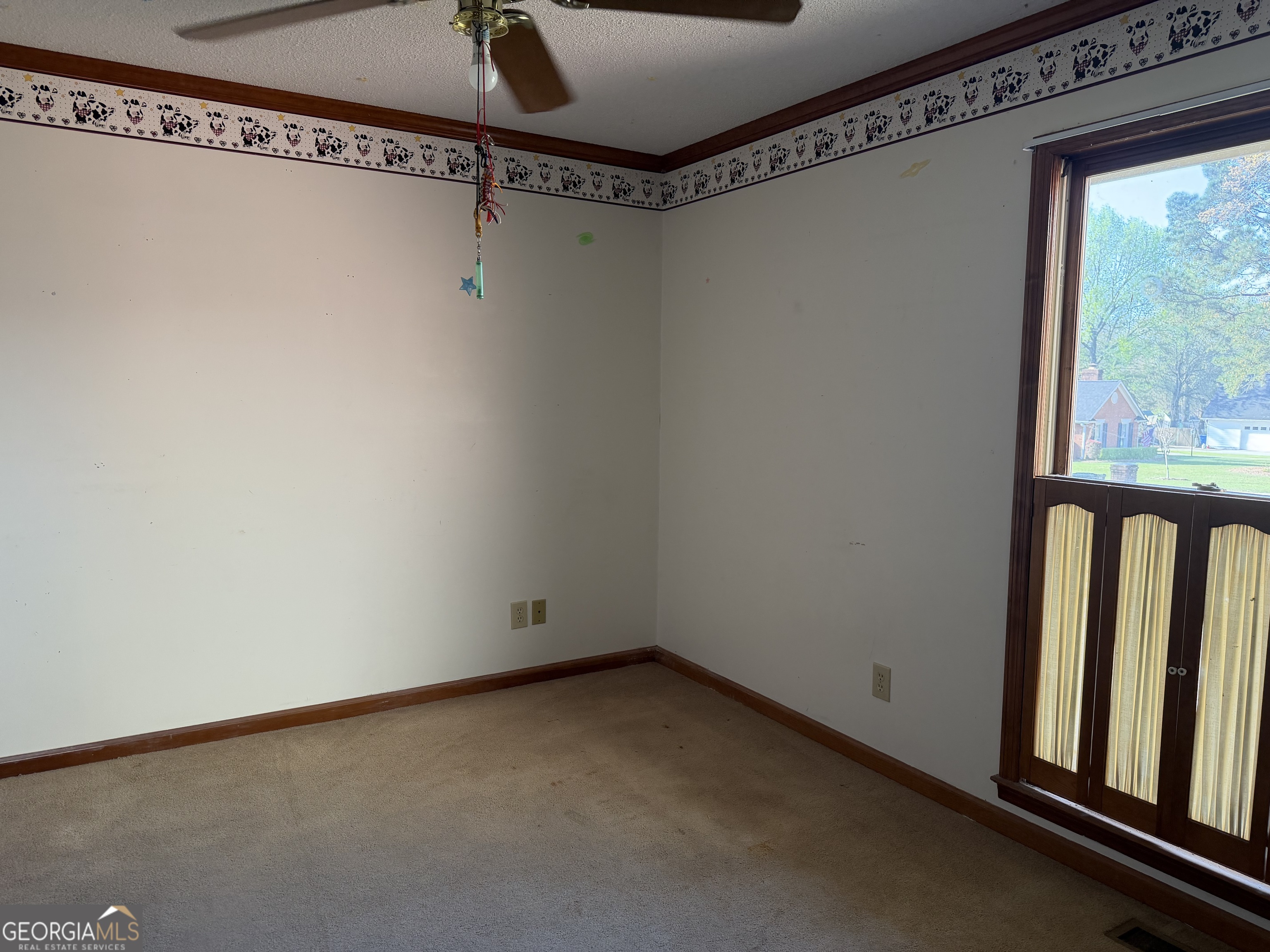 206 Ridge Circle Dublin, GA 31021 - Photo 23 of 40 a view of a room with racks on the wall