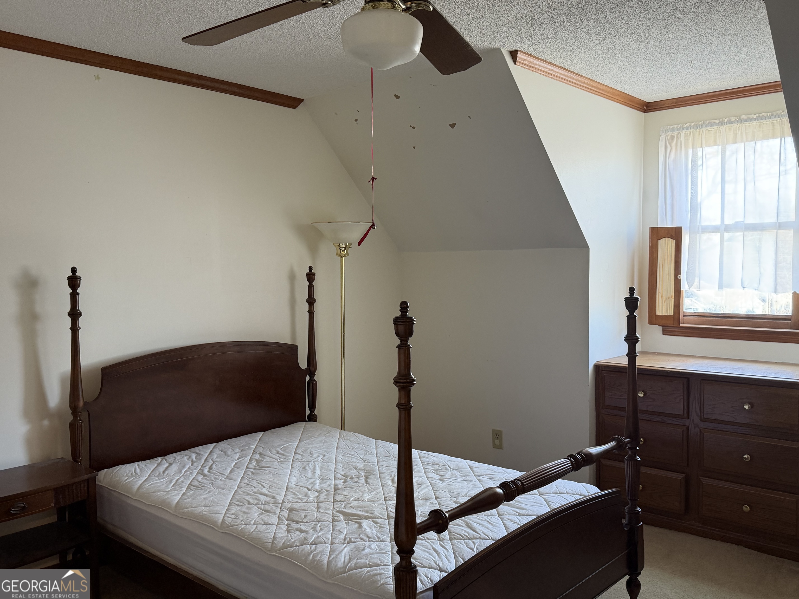 206 Ridge Circle Dublin, GA 31021 - Photo 32 of 40 a bedroom with a bed and a window