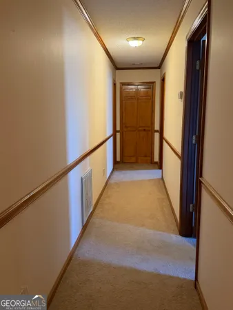a view of hallway with stairs