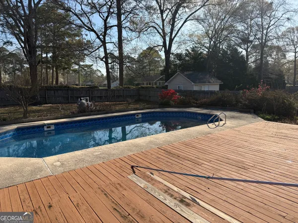 a view of a backyard and trees