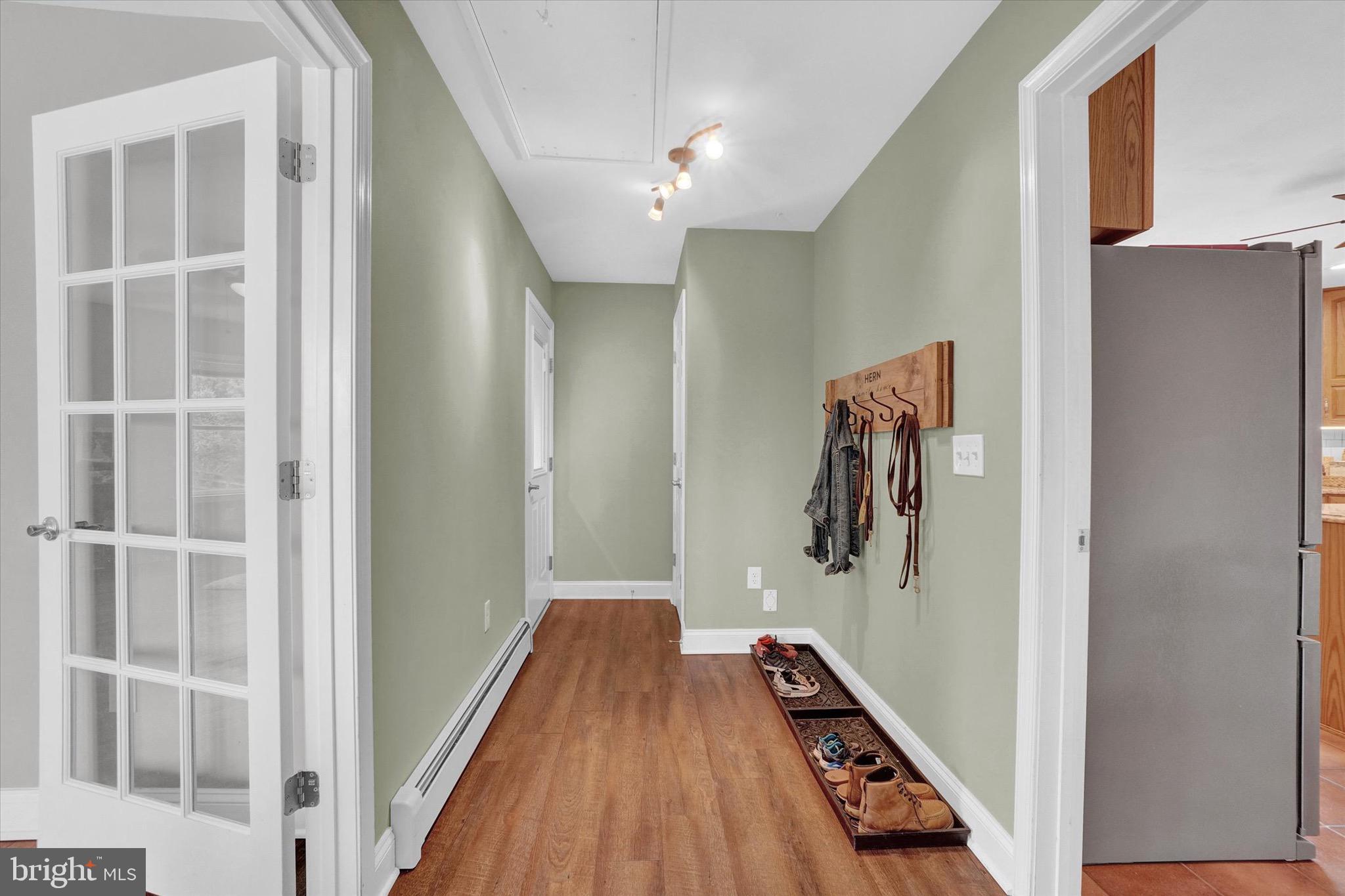 361 Bald Eagle Road Fawn Grove, PA 17321 - Photo 7 of 36 a view of a hallway with wooden floor and staircase