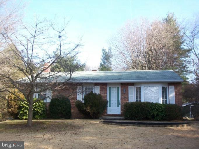 1221 Marclee Road Finksburg, MD 21048 - Photo 1 of 15 front view of a brick house with a yard