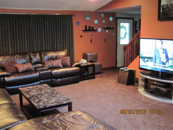 202 Easthampton Road Holyoke, MA 01040 - Photo 11 of 12 a living room with furniture and a mirror