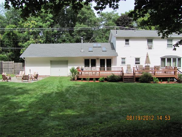 202 Easthampton Road Holyoke, MA 01040 - Photo 12 of 12 a front view of a house with a garden and yard