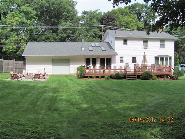 202 Easthampton Road Holyoke, MA 01040 - Photo 2 of 12 a front view of a house with a garden and trees