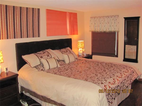 202 Easthampton Road Holyoke, MA 01040 - Photo 7 of 12 a bedroom with a bed and a window