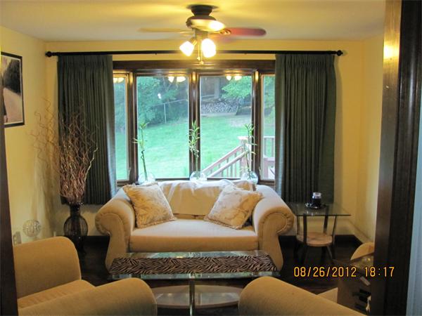 202 Easthampton Road Holyoke, MA 01040 - Photo 8 of 12 a living room with furniture and a large window