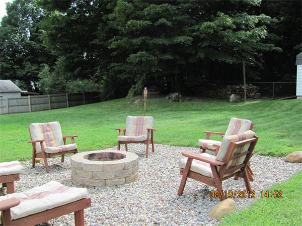 202 Easthampton Road Holyoke, MA 01040 - Photo 9 of 12 a view of a patio with chairs and a table