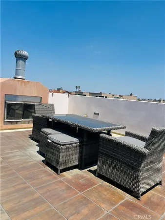 a view of a balcony with wooden floor