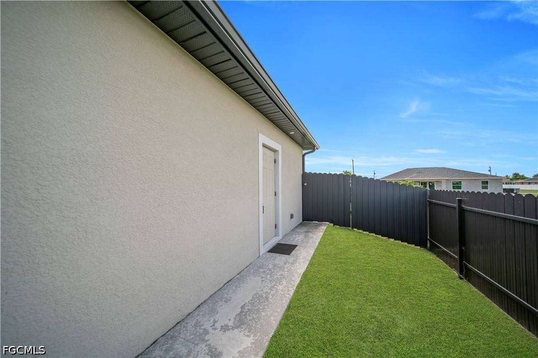 1128 Nelson Road North Cape Coral, FL 33993 - Photo 20 of 22 a view of a backyard