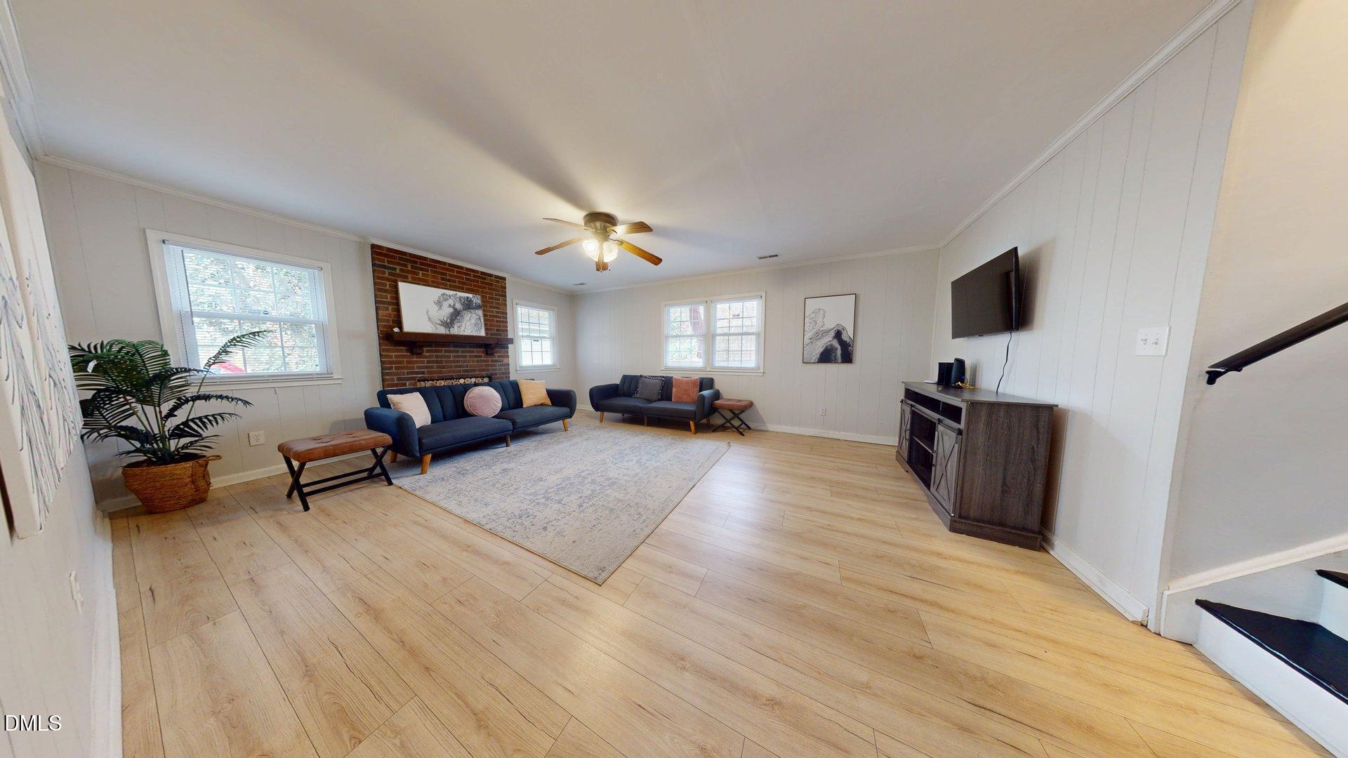 7720 Foxwood Drive Raleigh, NC 27615 - Photo 13 of 46 a living room with furniture and a flat screen tv
