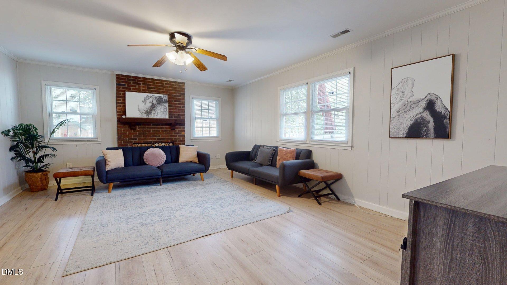 7720 Foxwood Drive Raleigh, NC 27615 - Photo 14 of 46 a living room with furniture and a window