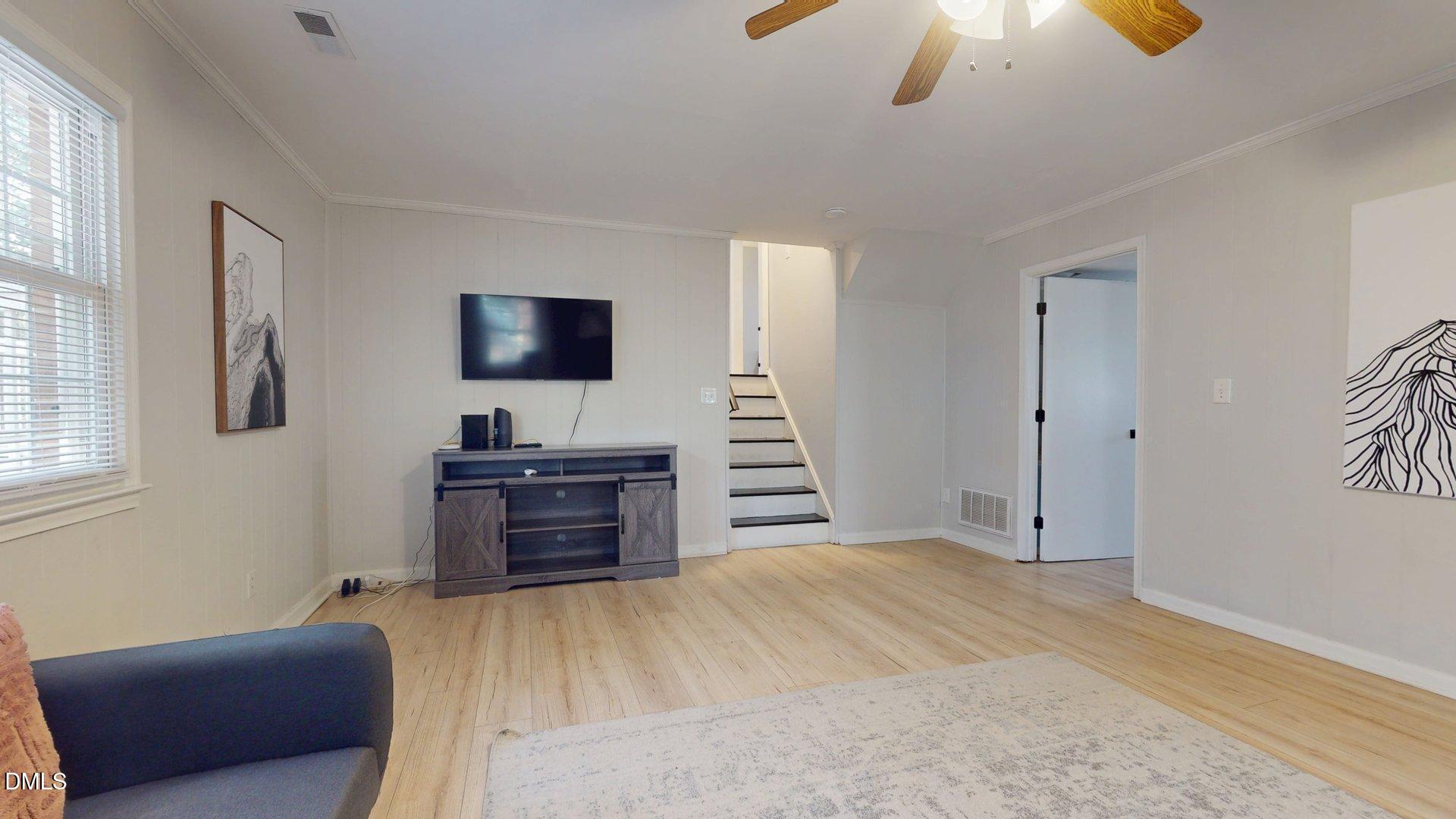 7720 Foxwood Drive Raleigh, NC 27615 - Photo 15 of 46 a bedroom with furniture and a flat screen tv