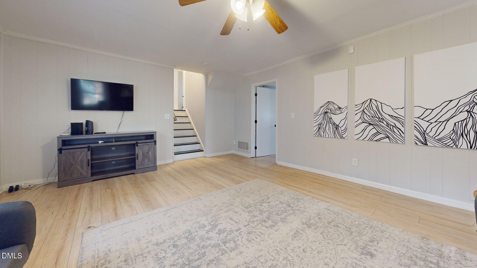 7720 Foxwood Drive Raleigh, NC 27615 - Photo 16 of 46 a bedroom with a bed and a flat screen tv