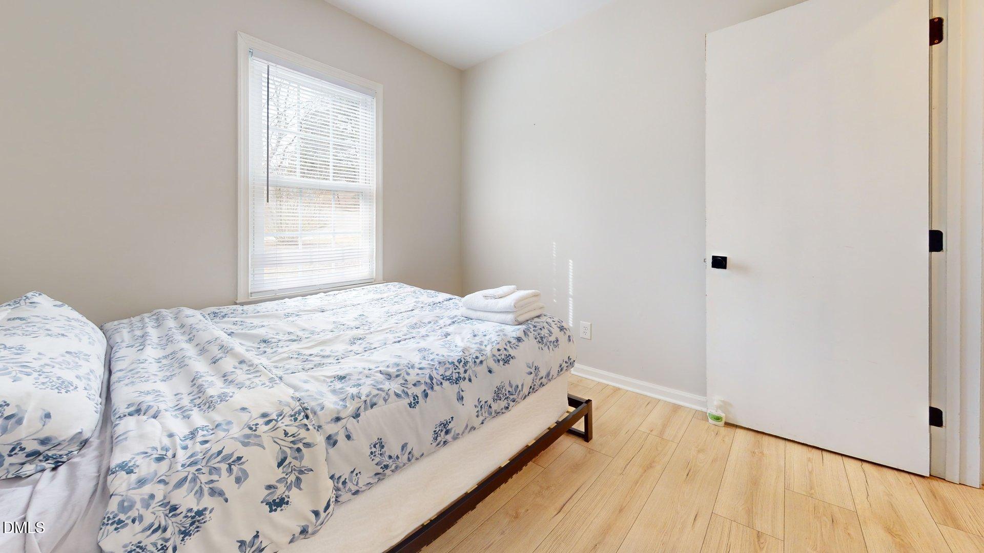 7720 Foxwood Drive Raleigh, NC 27615 - Photo 23 of 46 a bedroom with a bed and a window