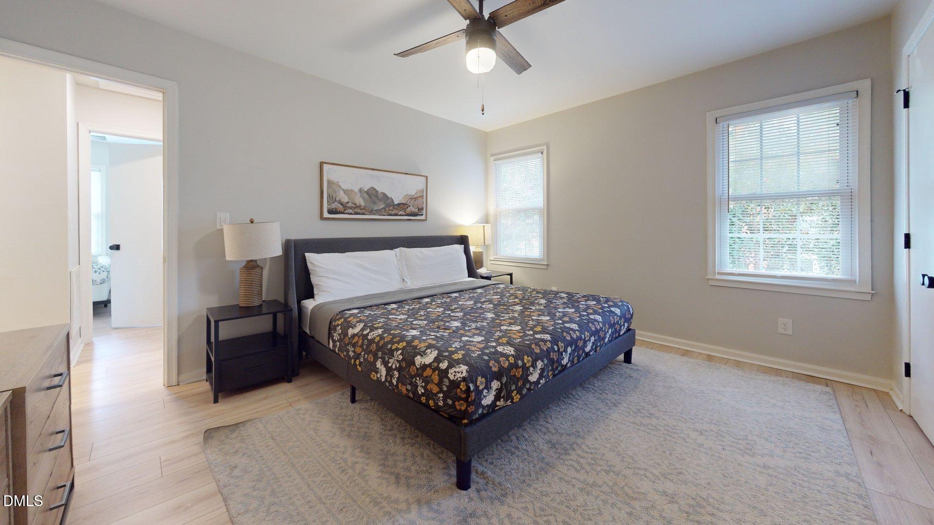 7720 Foxwood Drive Raleigh, NC 27615 - Photo 25 of 46 a bedroom with a bed rug and window