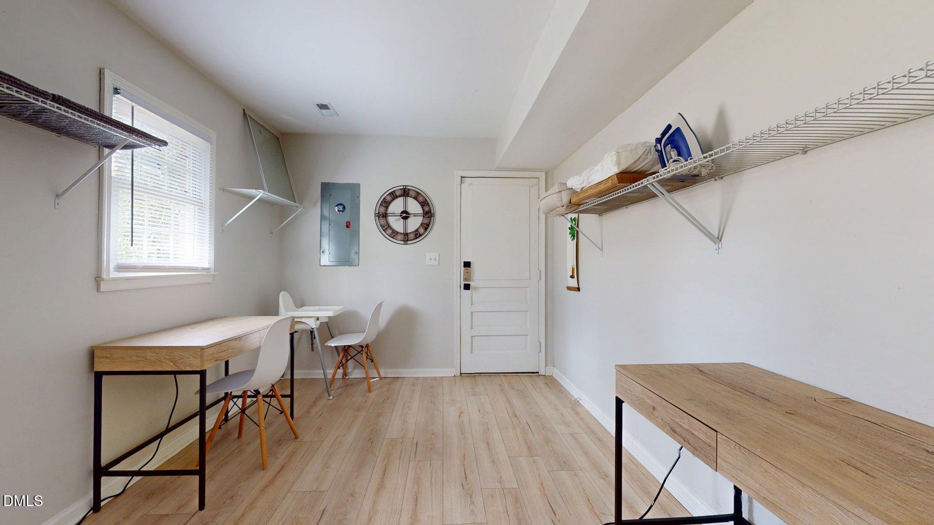 7720 Foxwood Drive Raleigh, NC 27615 - Photo 29 of 46 a view of a workspace with furniture and wooden floor