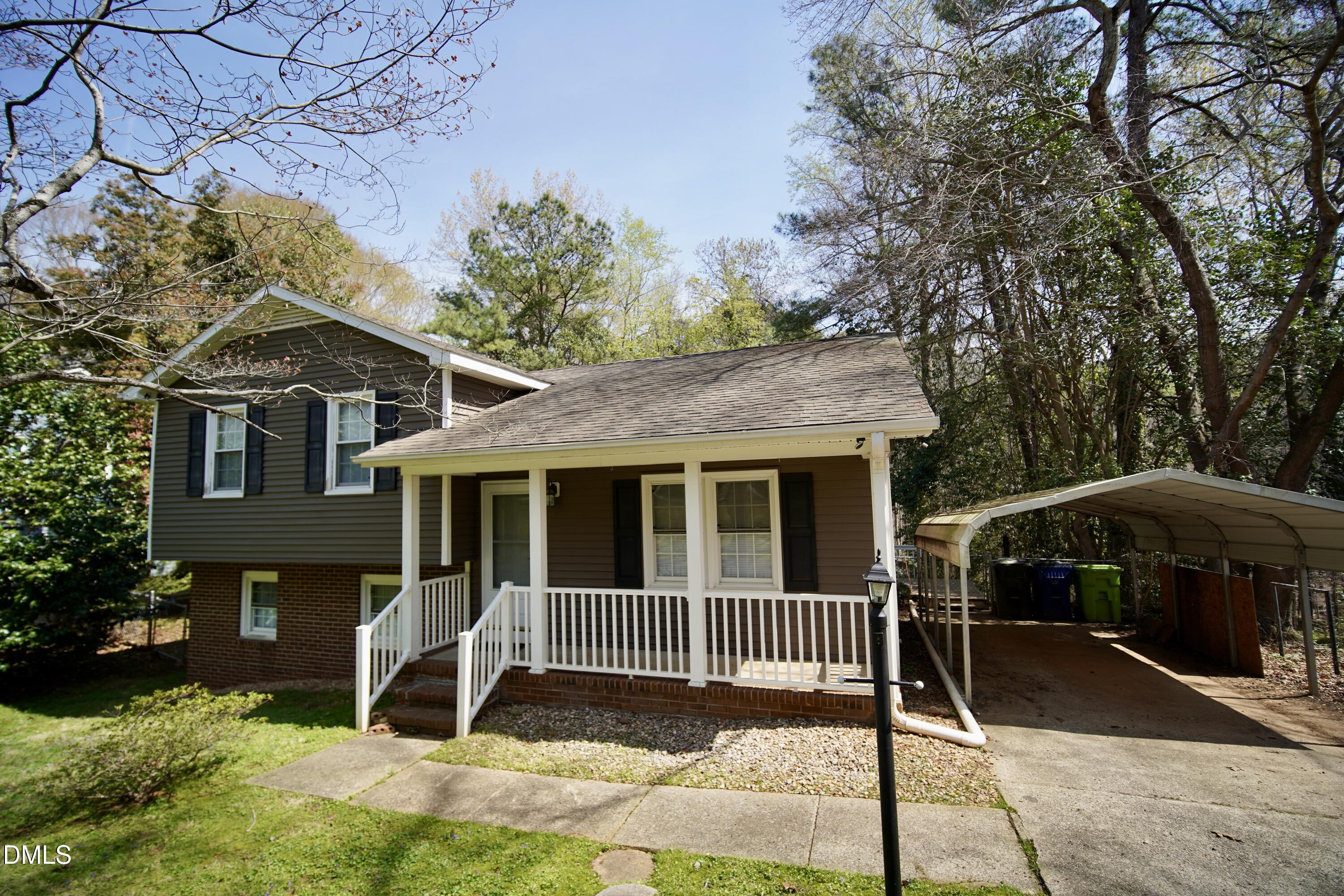 7720 Foxwood Drive Raleigh, NC 27615 - Photo 3 of 46 a view of a house with a yard