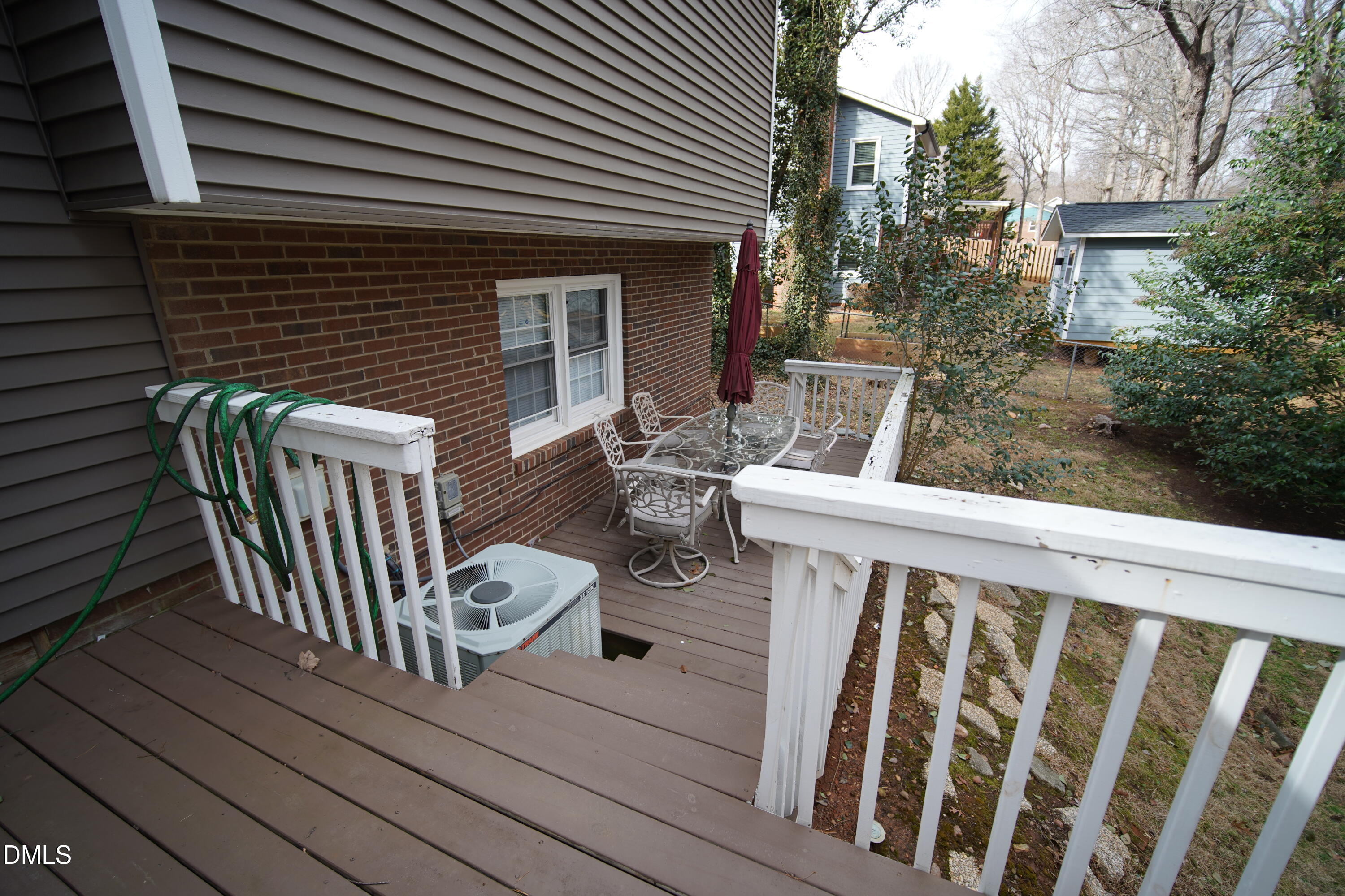 7720 Foxwood Drive Raleigh, NC 27615 - Photo 36 of 46 a view of a chair and table in the balcony