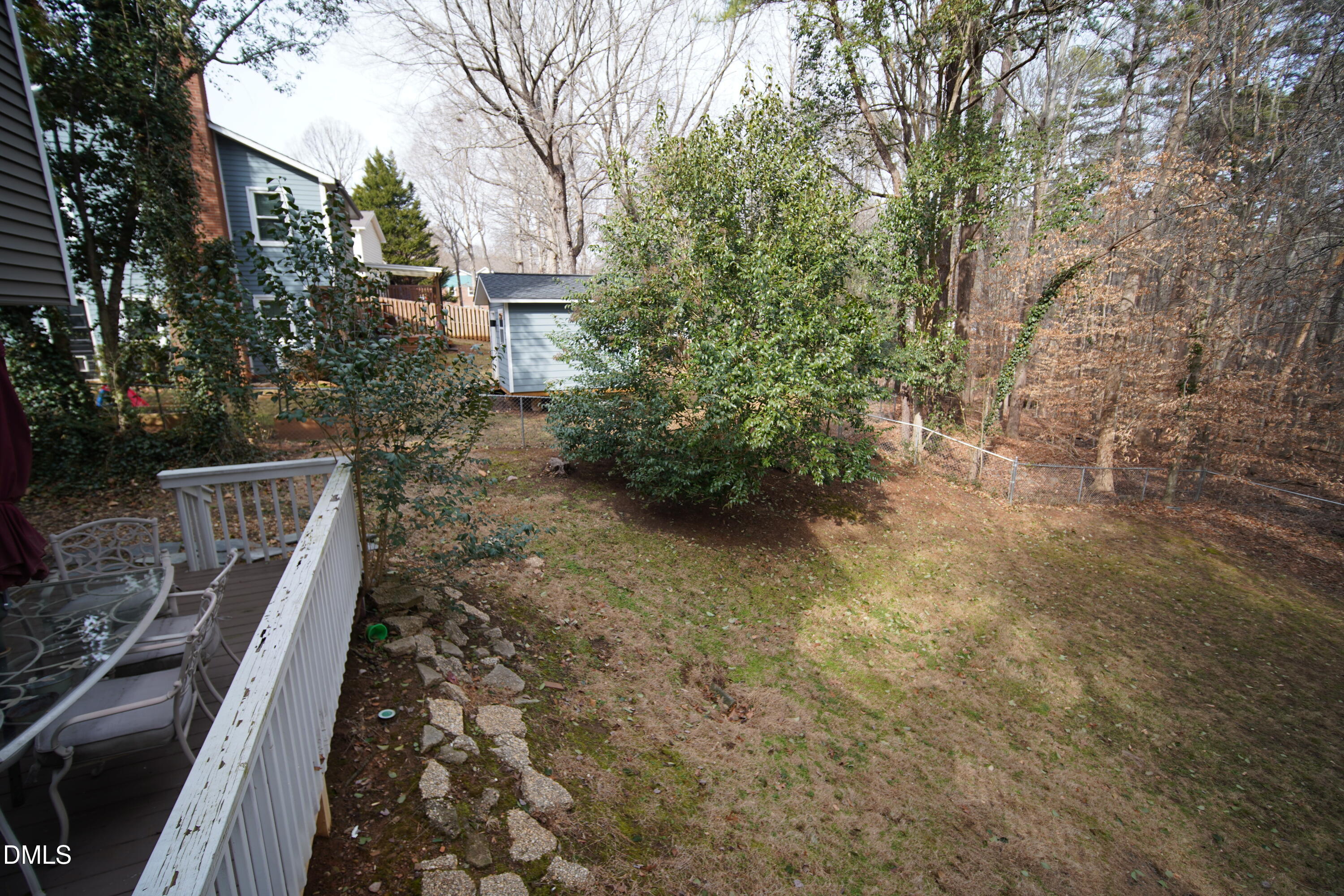 7720 Foxwood Drive Raleigh, NC 27615 - Photo 37 of 46 a backyard of a house with lots of green space