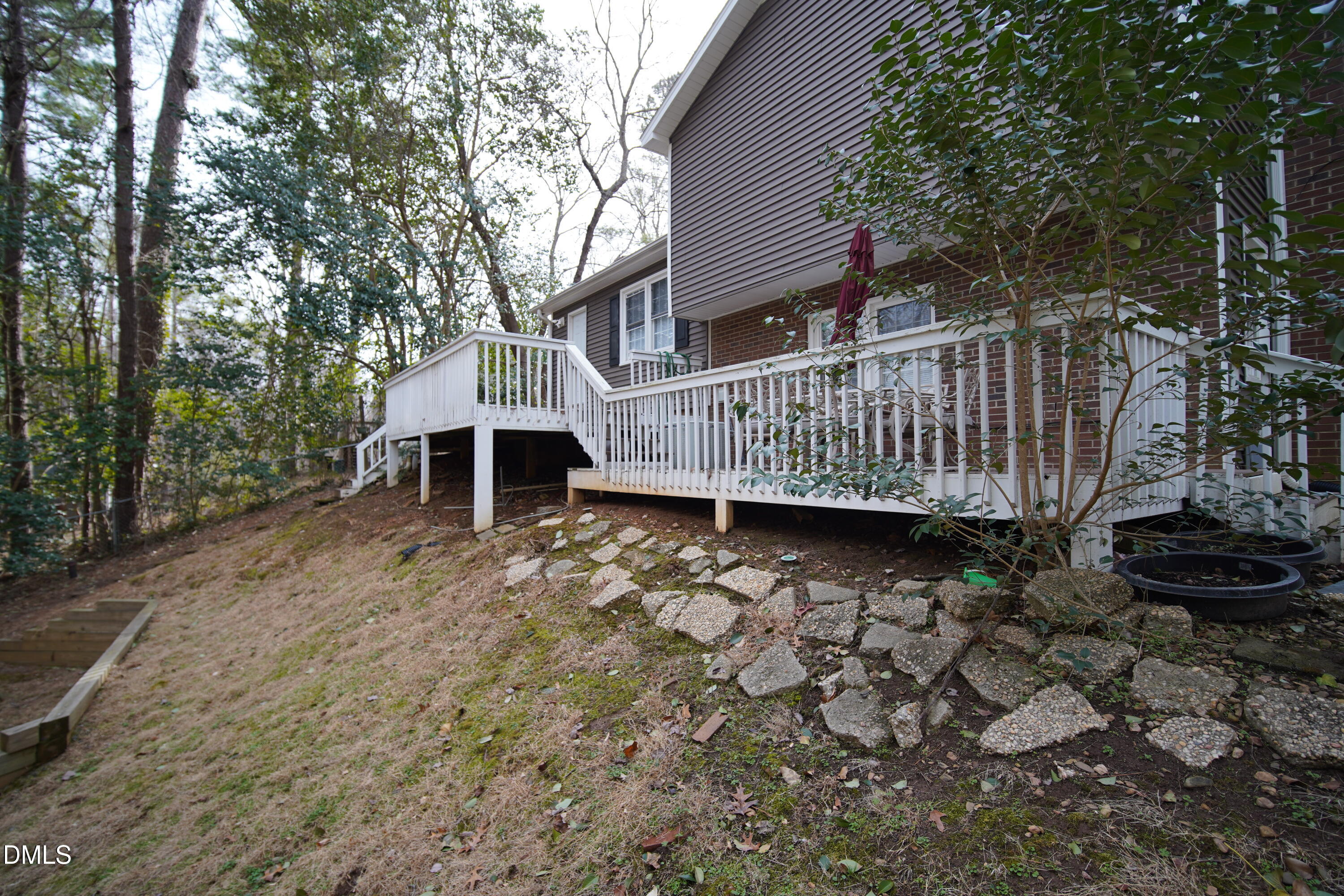 7720 Foxwood Drive Raleigh, NC 27615 - Photo 39 of 46 a view of a deck with a yard