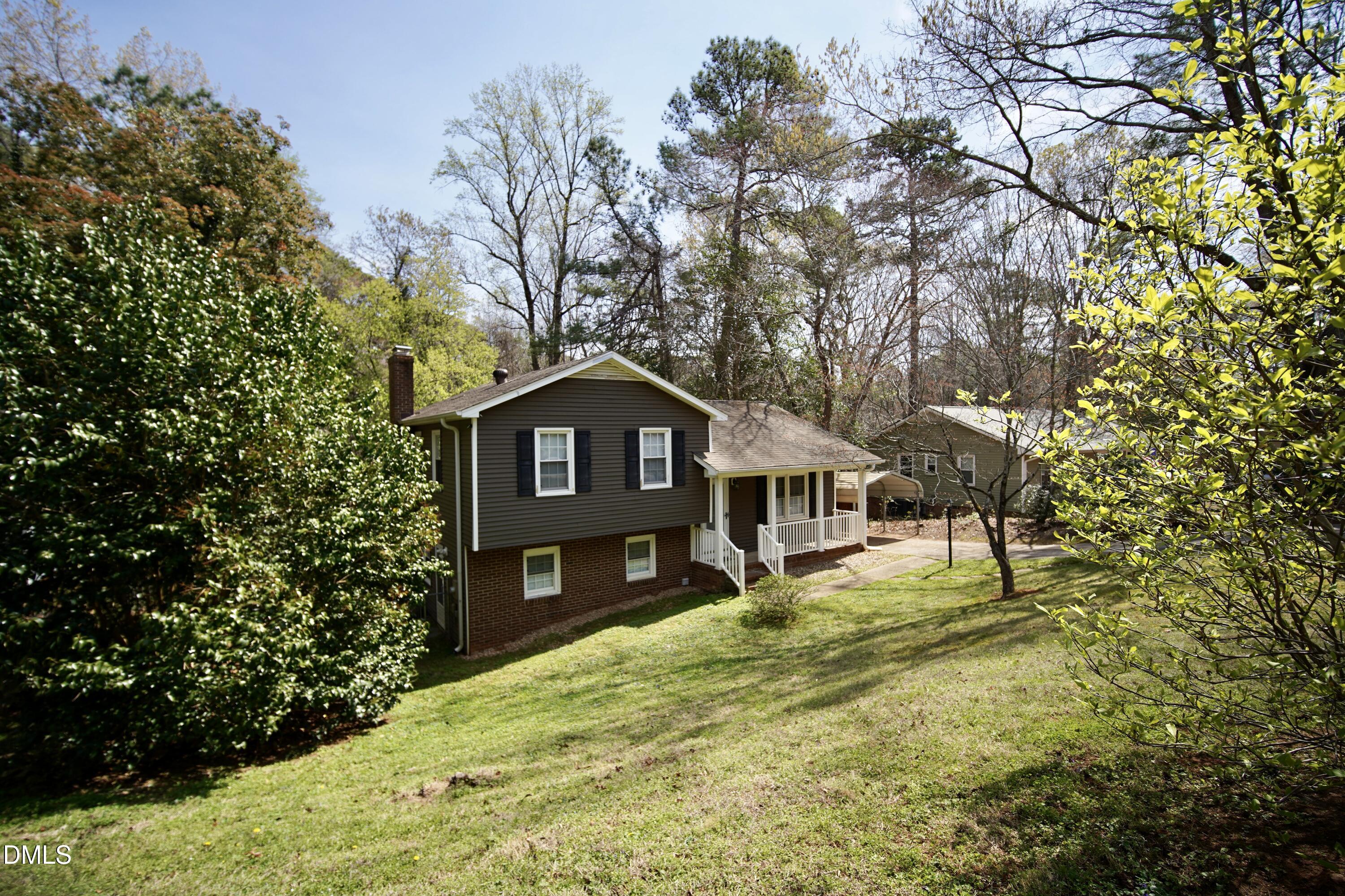 7720 Foxwood Drive Raleigh, NC 27615 - Photo 4 of 46 a front view of a house with a yard