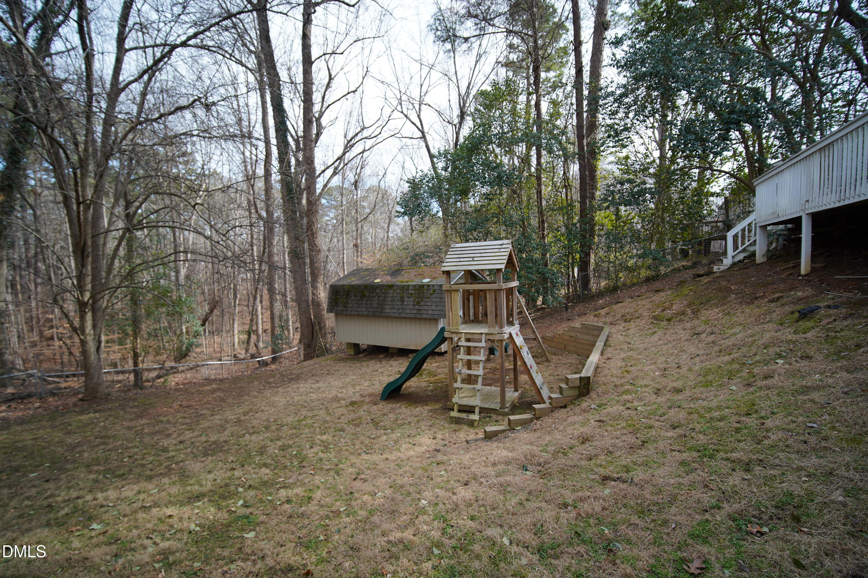 7720 Foxwood Drive Raleigh, NC 27615 - Photo 41 of 46 a bench is sitting in middle of forest
