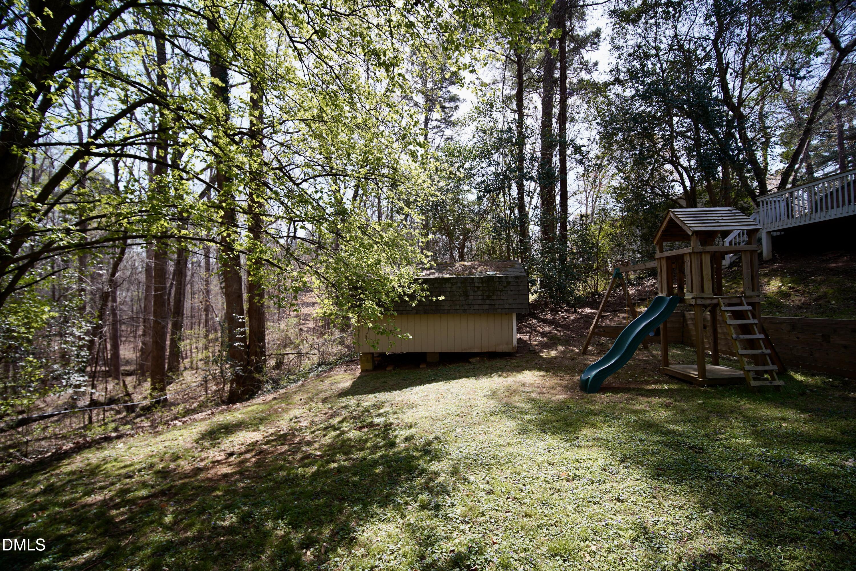 7720 Foxwood Drive Raleigh, NC 27615 - Photo 45 of 46 a view of a backyard with a tree