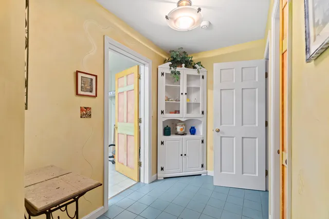 a bathroom with a sink mirror toilet and shower