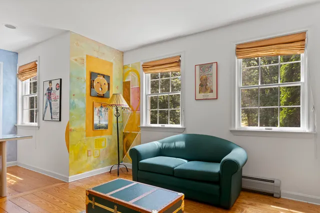 a view of a livingroom with furniture and workspace