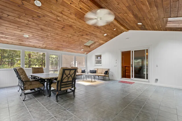 a view of a patio with table and chairs