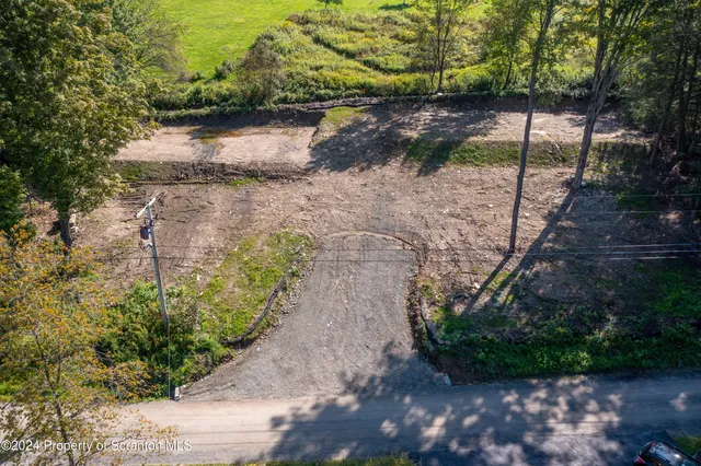 a view of a pathway with a yard