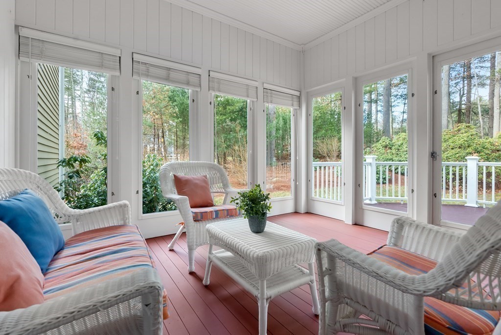 353 Dutton Road Sudbury, MA 01776 - Photo 16 of 42 a living room with furniture and floor to ceiling windows