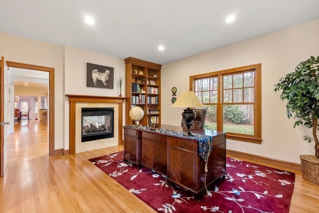 353 Dutton Road Sudbury, MA 01776 - Photo 17 of 42 a living room with furniture and a fireplace
