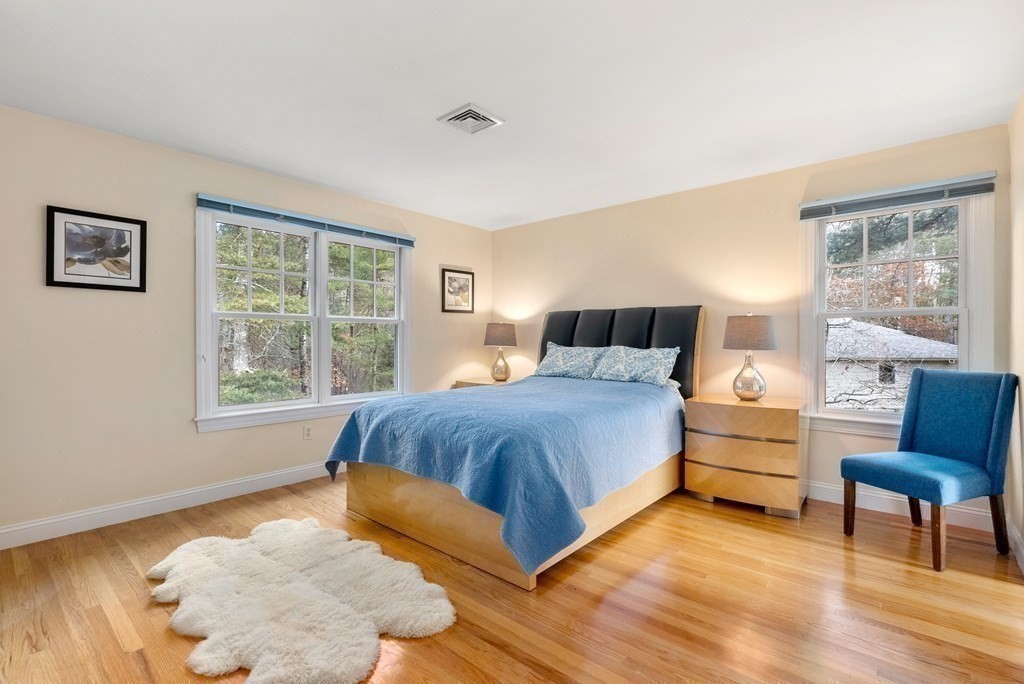 353 Dutton Road Sudbury, MA 01776 - Photo 22 of 42 a bedroom with a bed and a couch