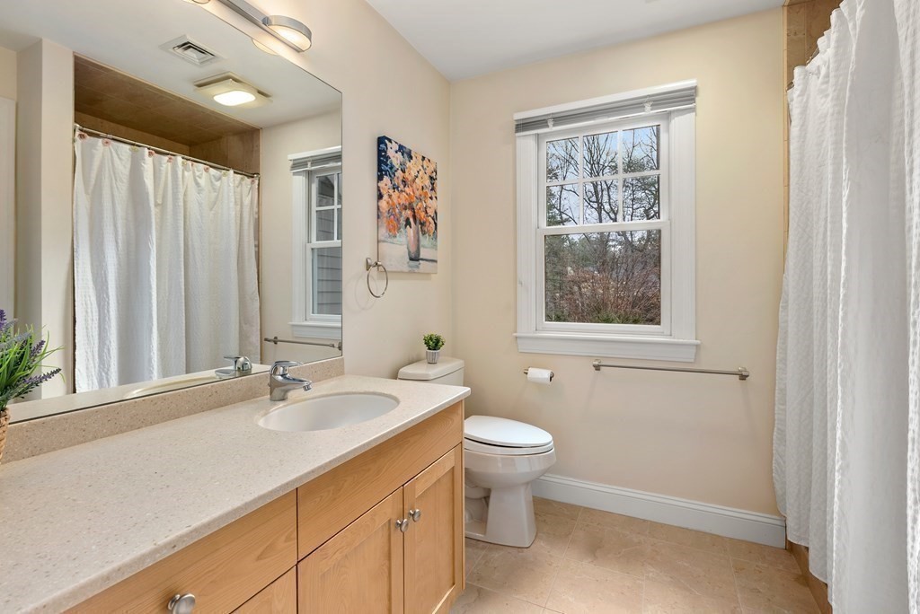 353 Dutton Road Sudbury, MA 01776 - Photo 23 of 42 a bathroom with a toilet sink and mirror