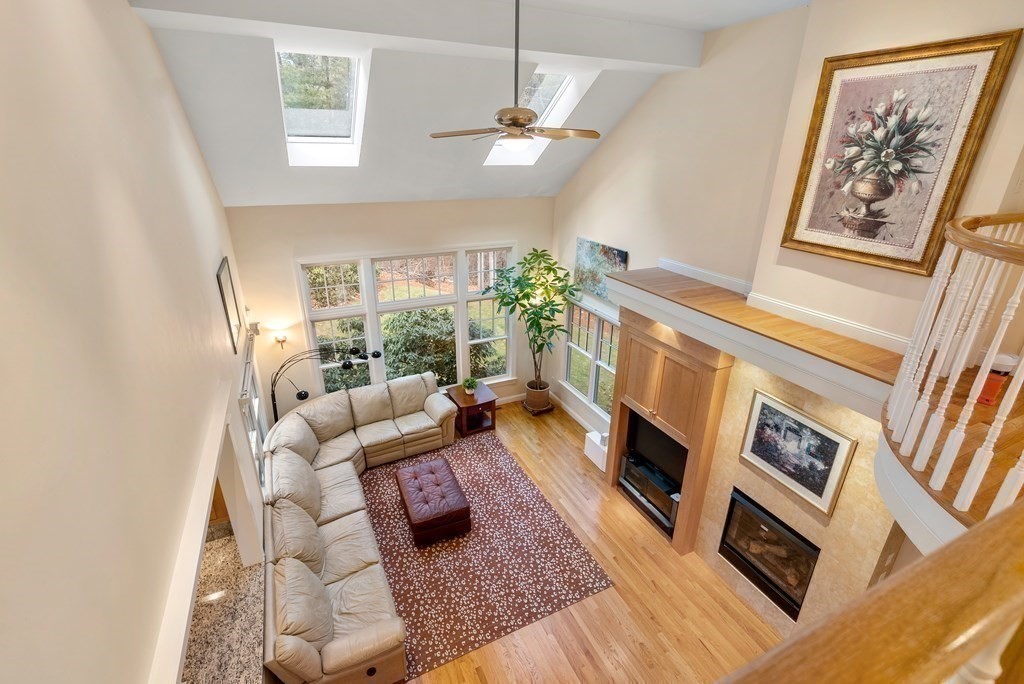 353 Dutton Road Sudbury, MA 01776 - Photo 24 of 42 a living room with furniture and a fireplace