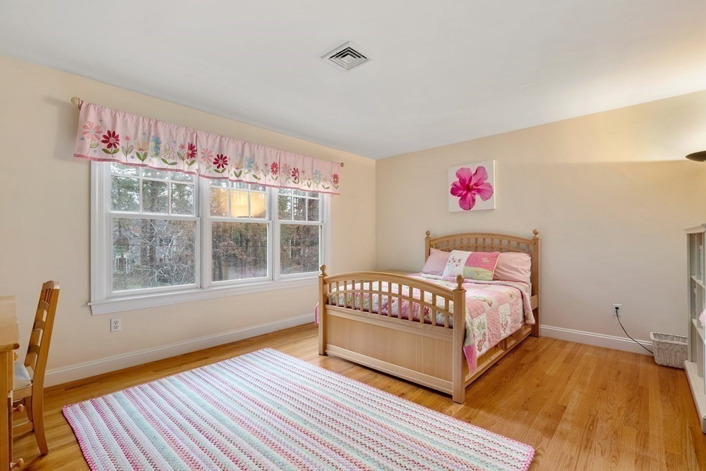 353 Dutton Road Sudbury, MA 01776 - Photo 27 of 42 a bedroom with a bed and a window