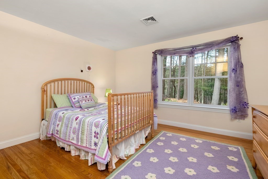 353 Dutton Road Sudbury, MA 01776 - Photo 28 of 42 a bedroom with a bed and a window