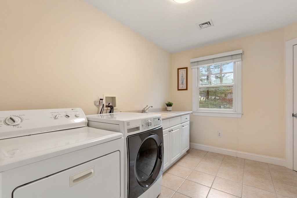 353 Dutton Road Sudbury, MA 01776 - Photo 30 of 42 a utility room with dryer and washer