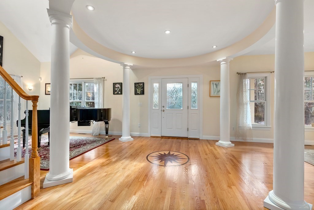 353 Dutton Road Sudbury, MA 01776 - Photo 3 of 42 a view of a big room with wooden floor and windows