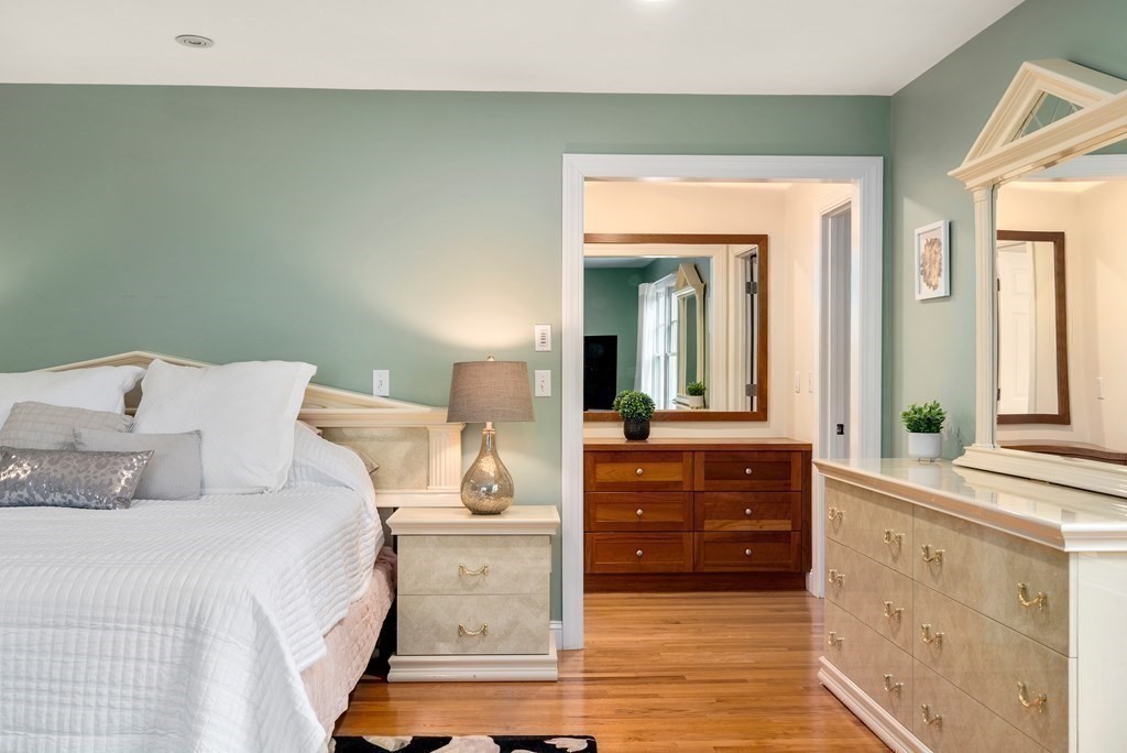 353 Dutton Road Sudbury, MA 01776 - Photo 32 of 42 a bedroom with a bed and a dresser