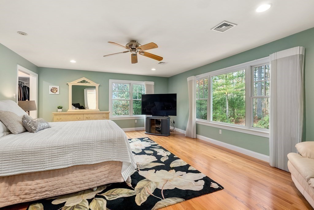 353 Dutton Road Sudbury, MA 01776 - Photo 33 of 42 a bedroom with a bed and flat screen tv