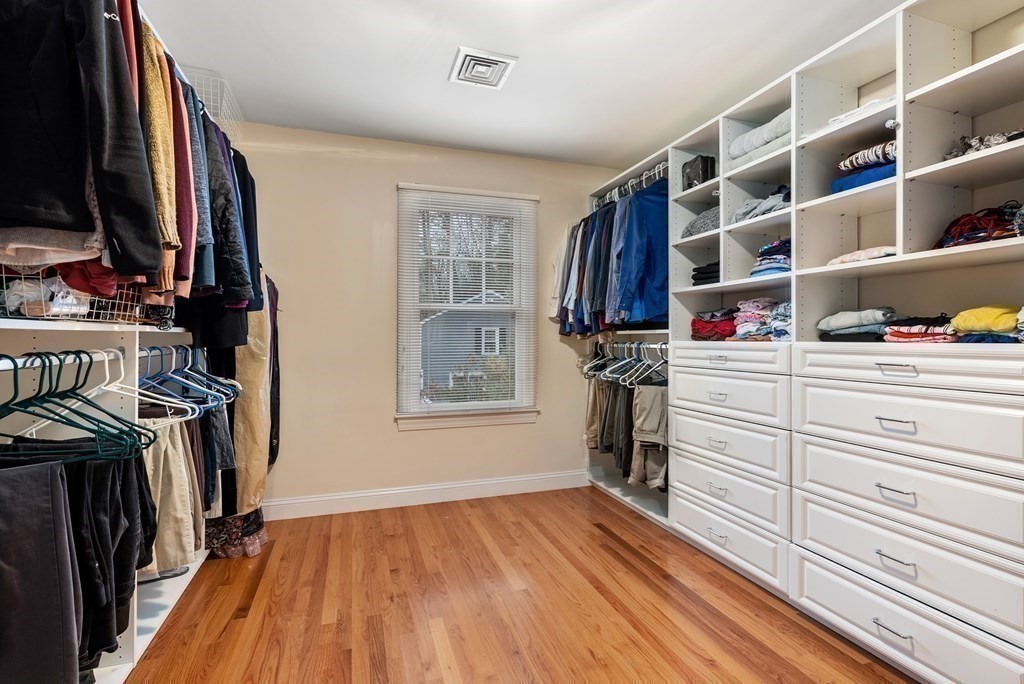 353 Dutton Road Sudbury, MA 01776 - Photo 35 of 42 a view of walk in closet with clothes and shoes