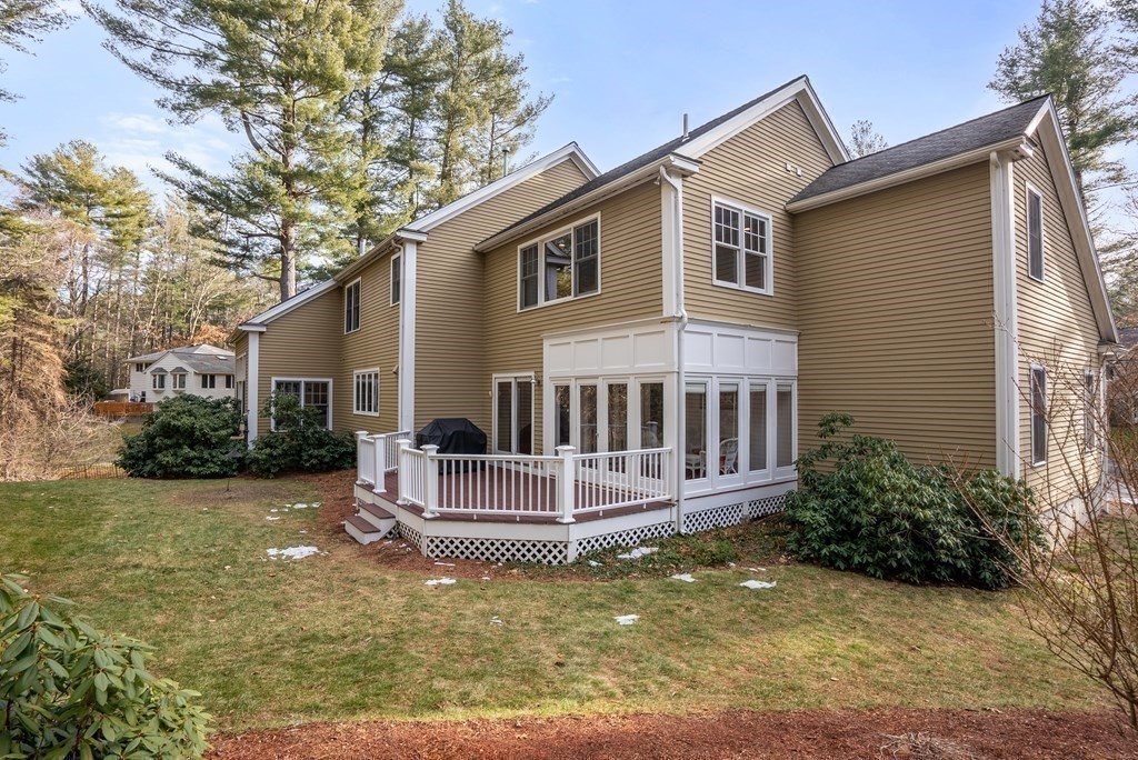 353 Dutton Road Sudbury, MA 01776 - Photo 39 of 42 a view of house with yard and sitting area