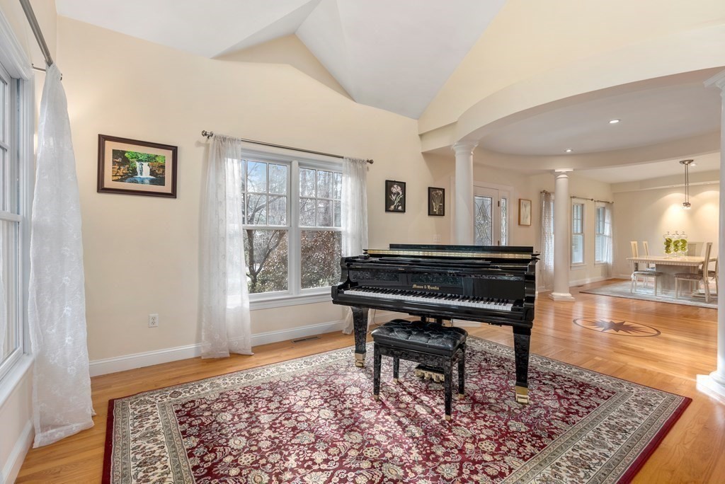 353 Dutton Road Sudbury, MA 01776 - Photo 4 of 42 a living room with a coffee table and a rug